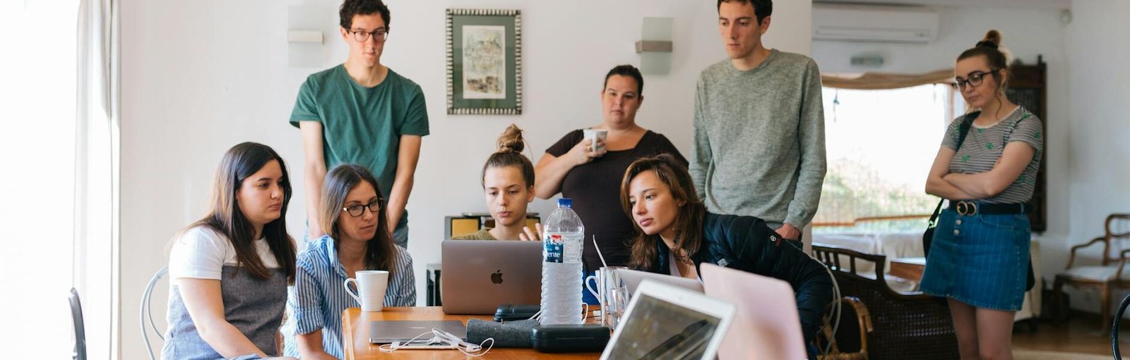 group of people watching on laptop