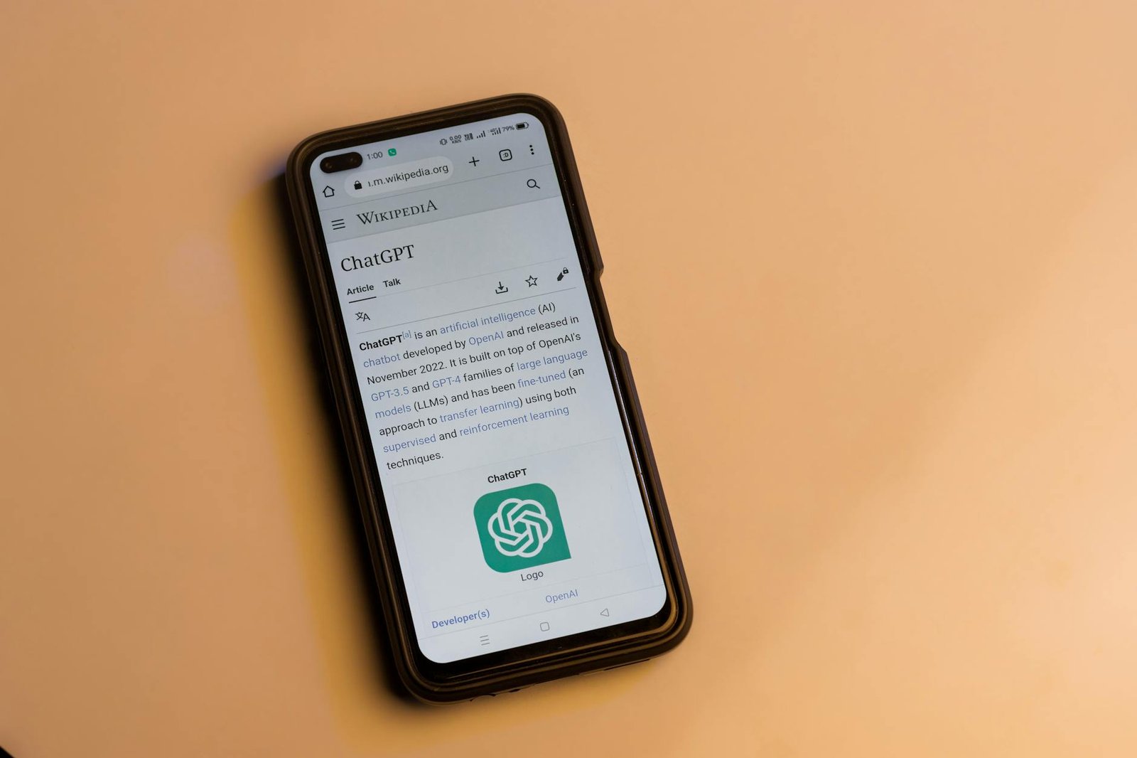 webpage of chatgpt a prototype ai chatbot is seen on the website of openai on a smartphone examples capabilities and limitations are shown