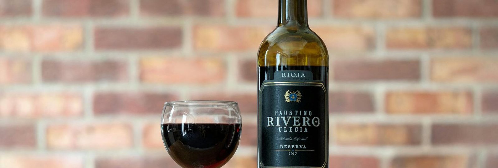 selective focus of wine in glass and bottle