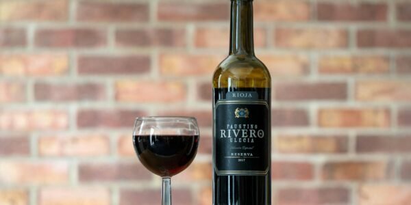 selective focus of wine in glass and bottle