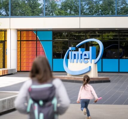 women in front of an office building