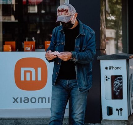 unrecognizable man standing in city street