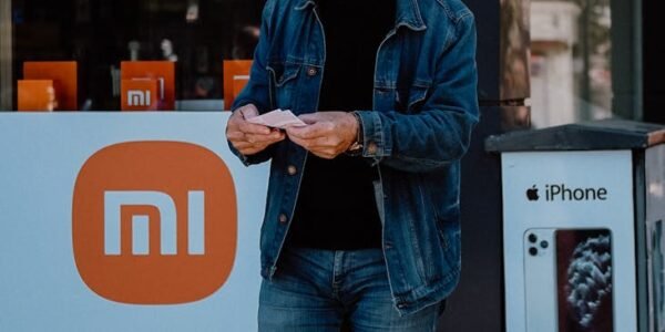 unrecognizable man standing in city street