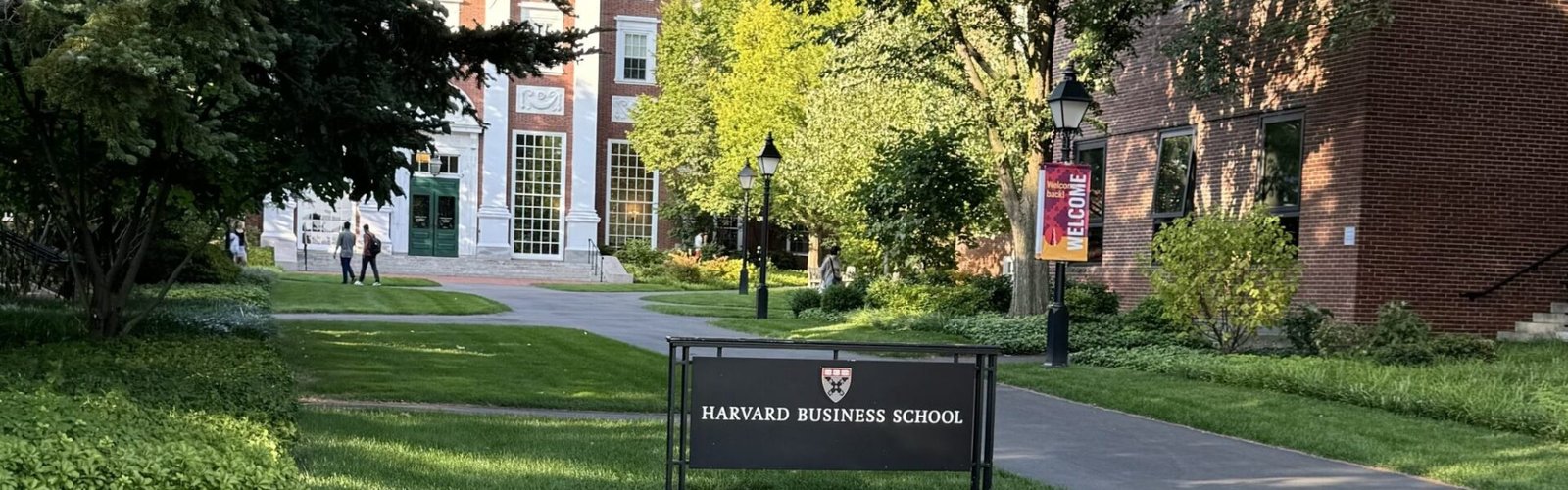The entrance of the Harvard Business School at Cambridge, Massachusetts, with the Harvard Business School visible, and the Baker Library behind it.
