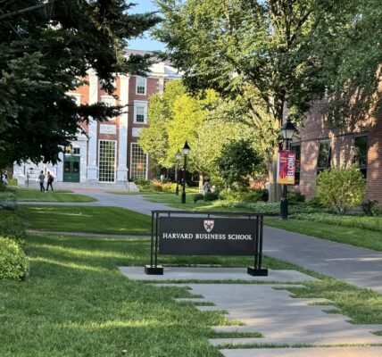 The entrance of the Harvard Business School at Cambridge, Massachusetts, with the Harvard Business School visible, and the Baker Library behind it.