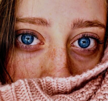 woman with blue eyes wrapped in a pink cloth