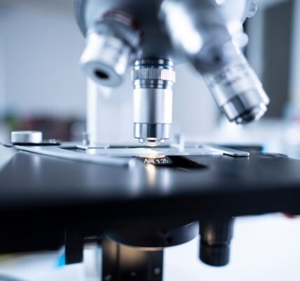 shallow focus photography of microscope