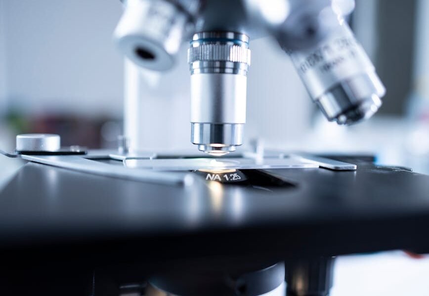 shallow focus photography of microscope