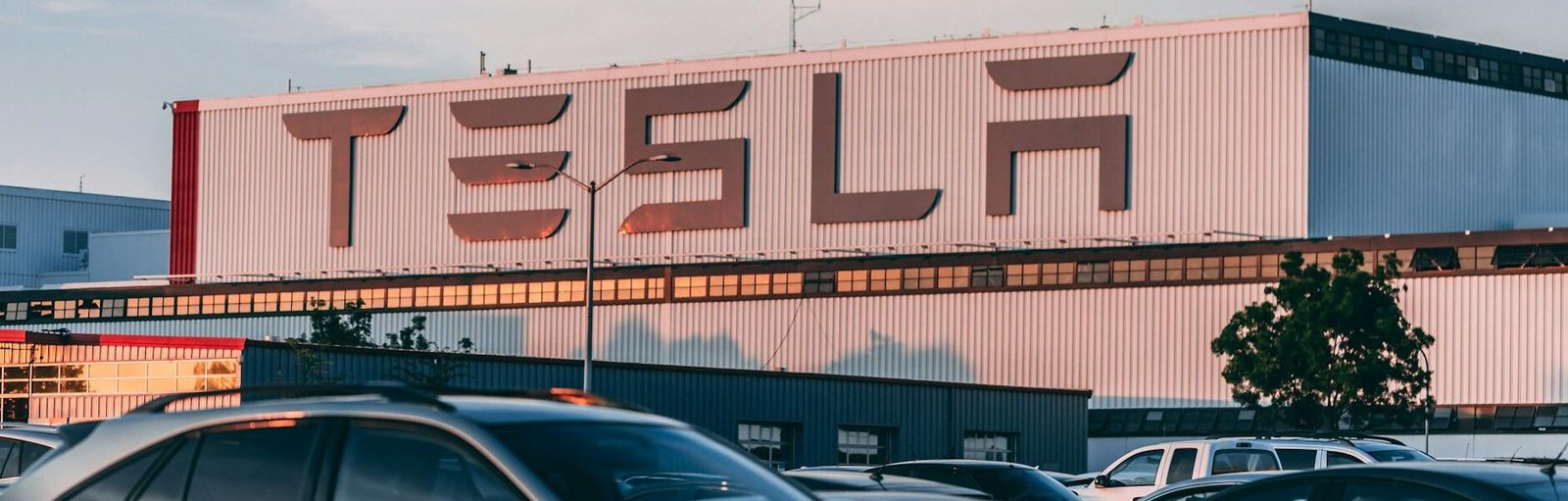 cars parked in front of company building