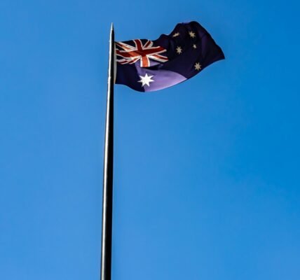 blue white and red flag under blue sky during daytime