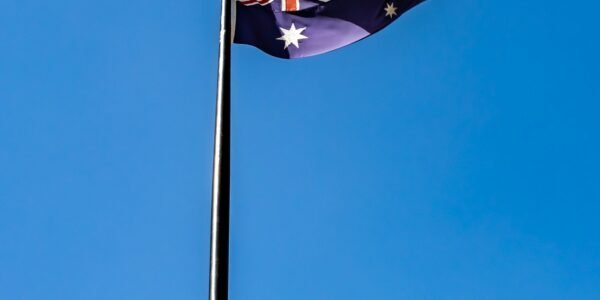 blue white and red flag under blue sky during daytime