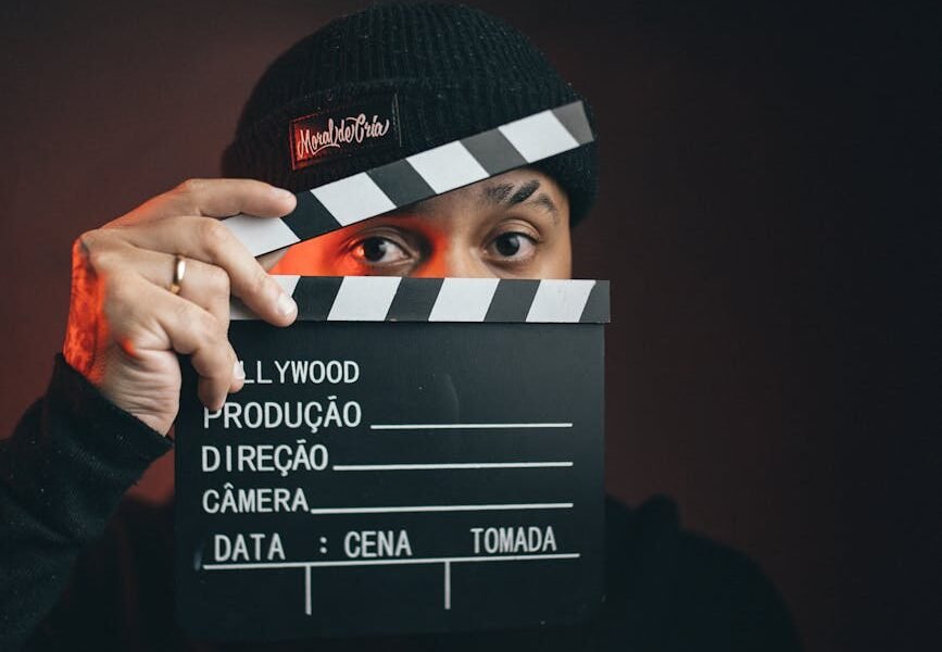 portrait of man with clapperboard