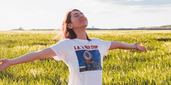 woman standing in green field