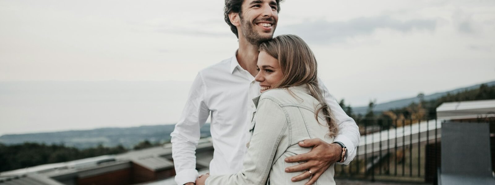 man and woman hugging each other