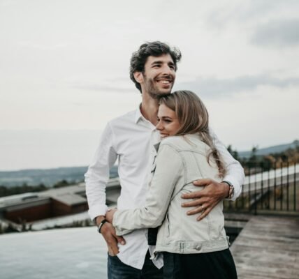 man and woman hugging each other