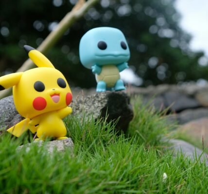yellow and white duck plush toy on green grass during daytime