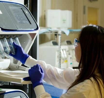 woman holding test tubes