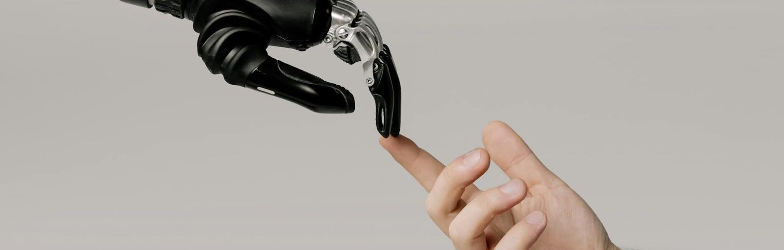bionic hand and human hand finger pointing